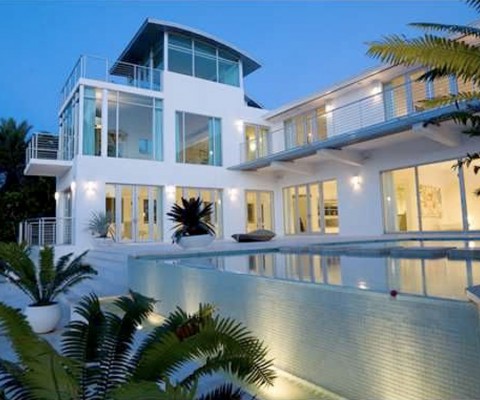 Brand new modern estate with 7 bedroom/8 bathroom including separate guest cottage, wide bay views, stunning bayfront pool, pond, manicured landscape, soaring ceilings, chef kitchen and large dock