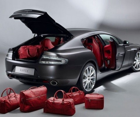 The Aston Martin Rapide Luxe features the same engine characteristics as the original Rapide but includes additional color options. The car comes with tailored luggage which matches the interior leather, a built in DVD system into the front seats, glass switches and a distinct key-fob