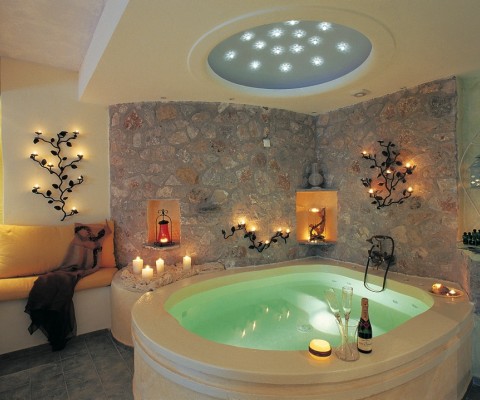 Astarte Suites is a spectacular 9-room complex designed by Aygoustis Krousis and located on a cliff on the beautiful Santorini Island in Greece. Small, but with impeccable services, infinity pool, and unforgettable views, the hotel is perfect for a romantic getaway. Here is an excerpt from the official description from the architects:
�Magic is in the details at Astarte Suites, beginning with the twinkling Swarovski stones that adorn the ceiling above each suite�s Jacuzzi pool, ending with the personalized service each guest enjoys. Surrounded by soothing shades of white and stone, guests are sure to find bliss here. During their precious down time, guests can relax and unwind next to Astarte�s stunning turquoise infinity swimming pool, which overlooks the Aegean Sea�s tranquil blue waters and nearby rocky cliffs. Leisure and cultural options abound nearby, such as in Akrotiri, an ancient city buried and preserved by volcanic ash-known as the Pompeii of the Greek islands-and at Red Beach and White Beach, the ultimate locales for a spectacular day of fun in the sun�.