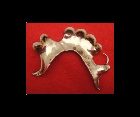 Paul Fraser Collectibles  is selling a collection of Churchill memorabilia that includes a set of gold-plated dentures worn by Sir Winston Churchill. The dentures come with a copy of a photograph of Sir Winston Churchill being escorted to his car by Wallace Stewart Ross, his last dentist 