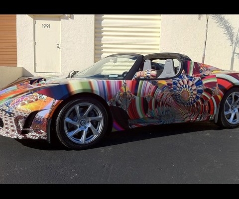 Typically the domain of BMW, the Gartel art car uses an electric Tesla Roadster as its canvas. The eclectic masterpiece was created for and unveiled at the Art Basel festival last week in Miami