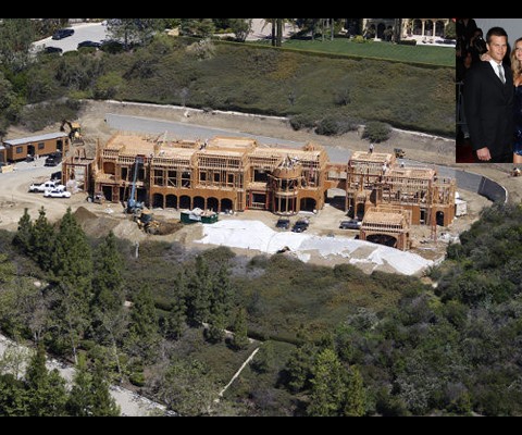 While the turf at Gillette Stadium is Brady's house, the grass is apparently greener in Brentwood, Calif., where the New England All-Pro and his model wife now reside in a 22,000-square-foot mansion. Returning to his West Coast roots, the San Mateo-native purchased the 3.75-acre vacant parcel for $11.75 million in 2008. He has since overseen the building of an approximately $20 million house, constructed by Boston-based Suffolk Construction, whose CEO John Fish happens to be a good friend of Brady's.